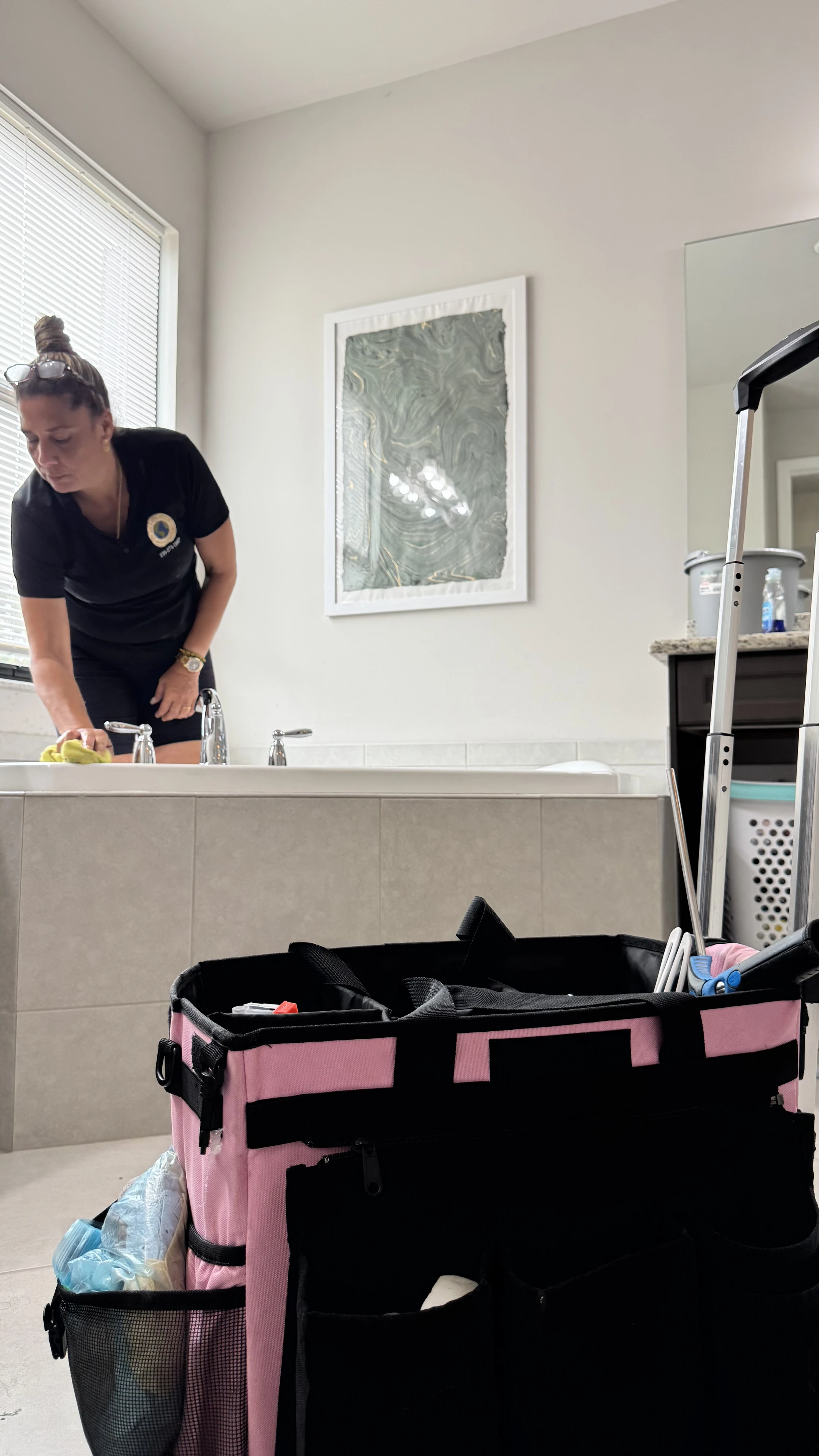 Smart Green team member cleaning a kitchen countertop